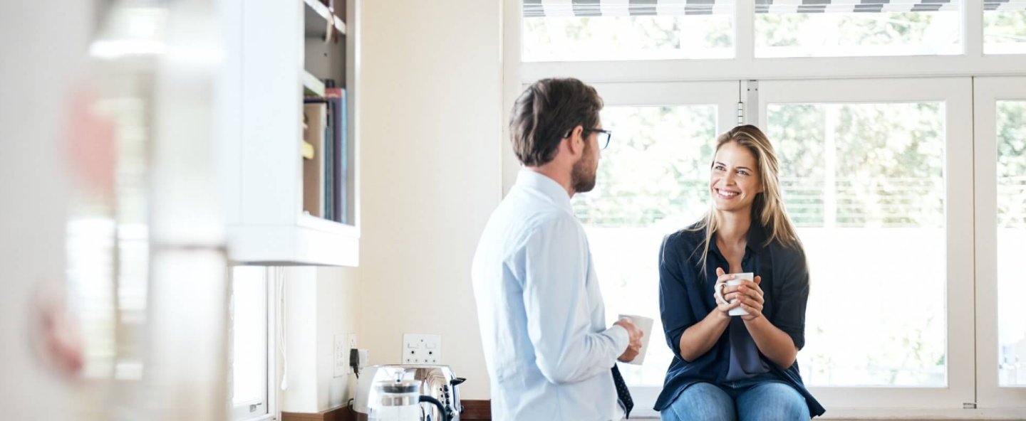 Couple talking in the kitchen